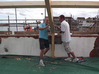 Asa and Dave inspect a roof strut.
