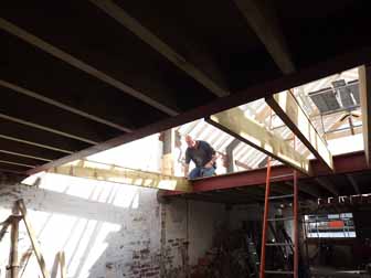 Jim moving a floor support into position.